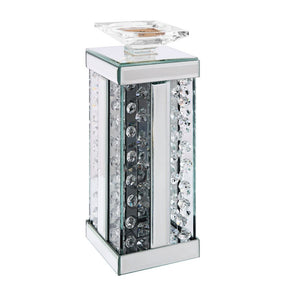 Nothing says ambiance quite like a flickering flame! Put your favorite scented candles or flameless designs on display with this classic Nysa candleholder. A versatile addition to your abode, it can be used in any room and features a mirrored frame with f