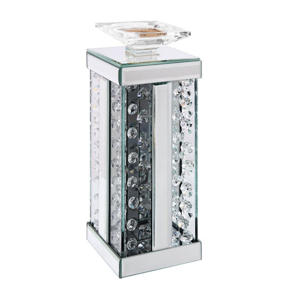 Nothing says ambiance quite like a flickering flame! Put your favorite scented candles or flameless designs on display with this classic Nysa candleholder. A versatile addition to your abode, it can be used in any room and features a mirrored frame with f