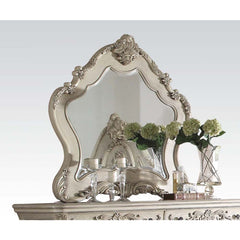 The Ragenardus mirror is an impeccable example of truly memorable luxurious traditional design. This antique white mirror features an arched frame with intricate floral design and beveled mirror. This piece is sure to bring a classy and traditional style 