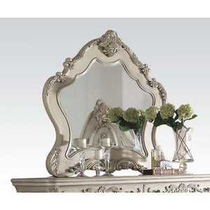 The Ragenardus mirror is an impeccable example of truly memorable luxurious traditional design. This antique white mirror features an arched frame with intricate floral design and beveled mirror. This piece is sure to bring a classy and traditional style 