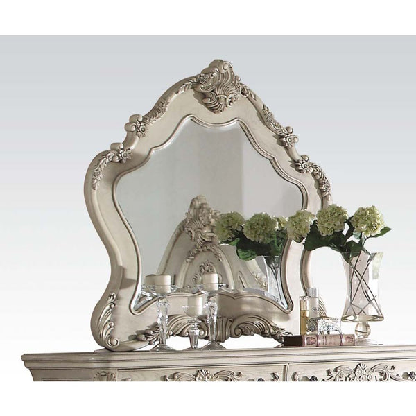 The Ragenardus mirror is an impeccable example of truly memorable luxurious traditional design. This antique white mirror features an arched frame with intricate floral design and beveled mirror. This piece is sure to bring a classy and traditional style 