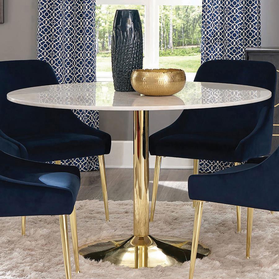 Add timeless sophistication to your dining space with this round dining table, featuring a luxurious white marble top and a radiant brass-finished pedestal base. The minimalist silhouette showcases modern elegance, while the subtle veining in the marble a