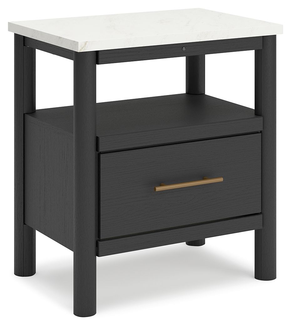This nightstand reflects your sophisticated approach to boho style. Crafted with both form and function in mind, its replicated marble top beautifully contrasts a matte black finish. The chic and convenient bedside companion offers ambient lighting, along