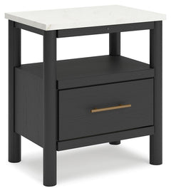 This nightstand reflects your sophisticated approach to boho style. Crafted with both form and function in mind, its replicated marble top beautifully contrasts a matte black finish. The chic and convenient bedside companion offers ambient lighting, along