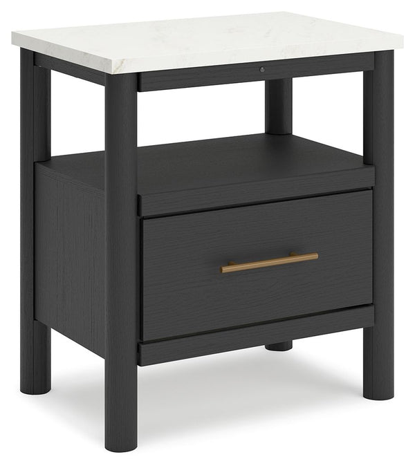 This nightstand reflects your sophisticated approach to boho style. Crafted with both form and function in mind, its replicated marble top beautifully contrasts a matte black finish. The chic and convenient bedside companion offers ambient lighting, along