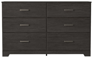  this dresser is a fresh style awakening. A warm charcoal hue over replicated oak grain easily complements other furniture finishes. Smooth drawer fronts with antiqued pewter-tone handles complete the aestheti