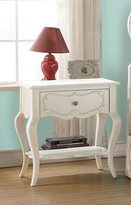 Create the dream bedroom for your little girl with Edalene collection. Beautiful accents are seen throughout including clear rosette knobs and tapered legs. The bed features a pearl white tufted headboard. With many storage options and details like floral
