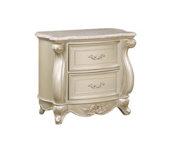 The Monique Marble Top 2 Drawer Nightstand in Champagne combines heirloom quality construction with French Provincial elegance. Crafted with poplar solids and birch veneers, this nightstand ensures strength and durability. Reflecting the charm and sophist