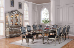 Designed exclusively for ACME, the Chantelle collection is filled with romantic wonder. This collection features a beautiful floral carved leg table available in two different sizes. Complemented by French rococo tufted silver gray silk like fabric chairs