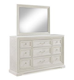 Introducing a bedroom collection that brings a breath of fresh sophistication to any living space. This suite boasts a bright, antique white finish that immediately brightens and opens up a room, providing a versatile foundation for any decor style. The b