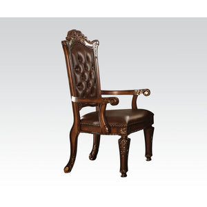 The Vendome executive arm chair classic style will blend masterfully in your home. Carefully constructed from faux leather, selected wood and veneers in rich Cherry Finish. Highly decorative details, button tufted backrest with Nailhead trim, and its deco