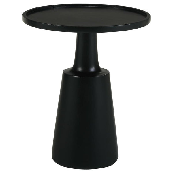 This global-inspired round accent table offers a striking design for any space. An elegant, solid contoured base tapers toward the top that supports a round table surface. Raised edges define the silhouette even further and keep items in place. Made of an