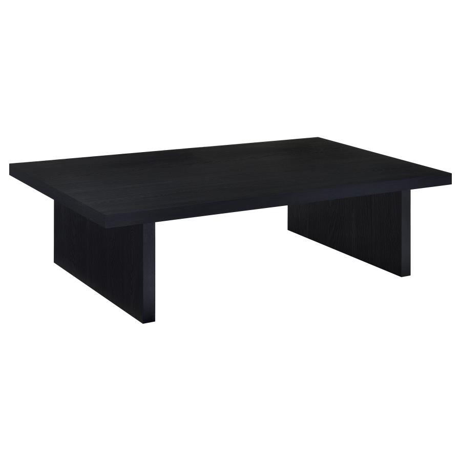This contemporary coffee table establishes a strong visual focal point in any living room. Its streamlined silhouette, rectangular shape, and refined black finish enhance modern minimalism. Crafted with an engineered wood core and protected by scratch-res