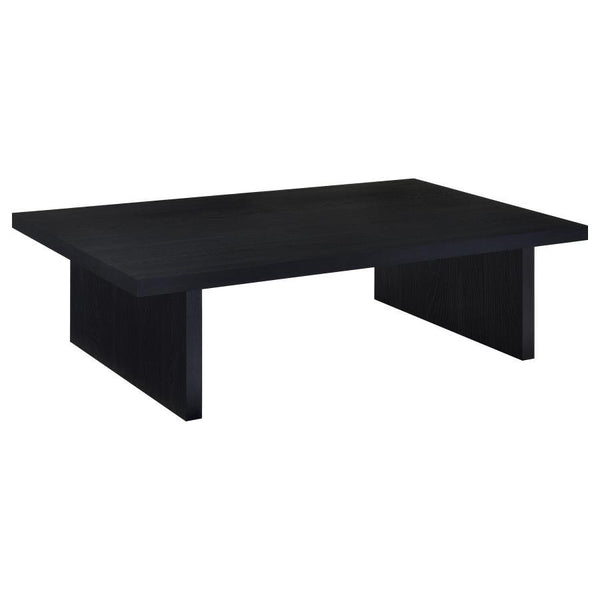 This contemporary coffee table establishes a strong visual focal point in any living room. Its streamlined silhouette, rectangular shape, and refined black finish enhance modern minimalism. Crafted with an engineered wood core and protected by scratch-res