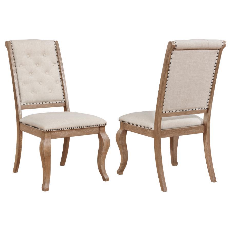 Nail head trim lends a refined presence to this tufted side chair. Ideal for a stylish dining room, this char features a plush, wide seat for optimal comfort. Its upholstered back is button tufted in a classic diamond motif, creating exceptional texture a