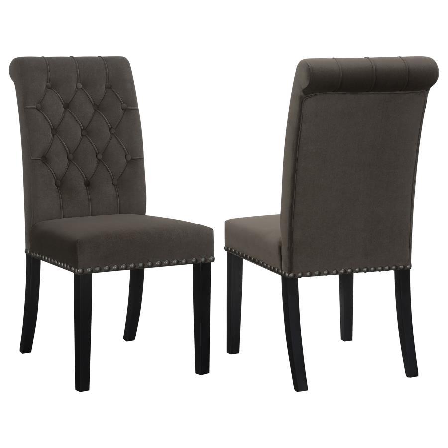 Blending timeless elegance with plush comfort, this side chair enhances any dining space. Its high backrest features a classic button-tufted design, adding depth and sophistication. A rolled top and hand-applied nailhead trim create refined detailing, whi