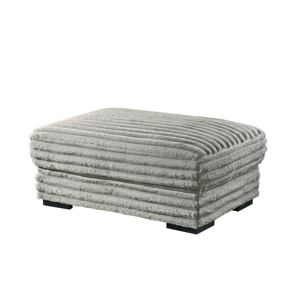 The Embrace Ottoman in gray is the perfect addition to your living space, offering both style and functionality. Crafted from 100% gray polyester fabric with a plush, blanket-like texture, it promises ultimate relaxation. This versatile piece can be used 