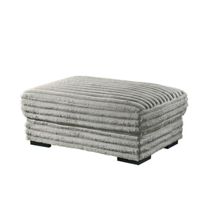 The Embrace Ottoman in gray is the perfect addition to your living space, offering both style and functionality. Crafted from 100% gray polyester fabric with a plush, blanket-like texture, it promises ultimate relaxation. This versatile piece can be used 