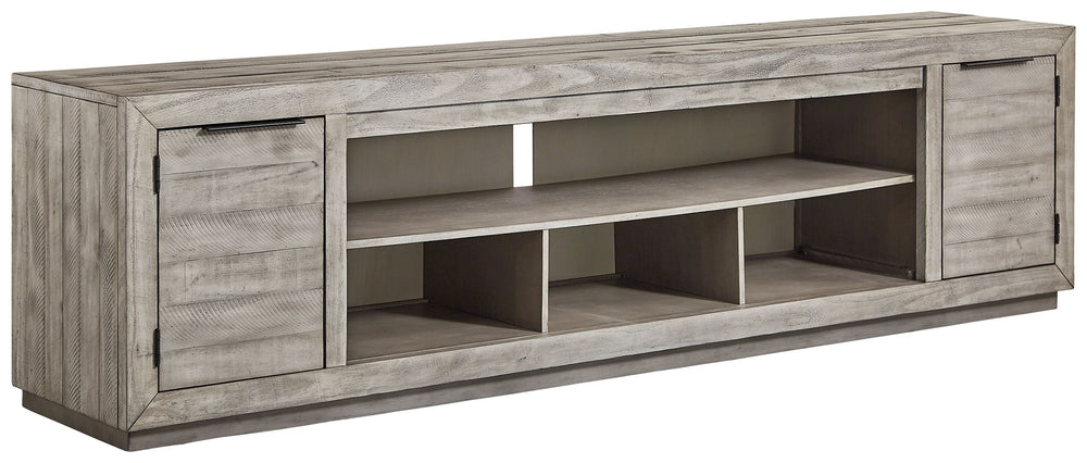Balancing chic flair with a relaxed sensibility, this extra-large TV stand strikes just the right tone for rustic sophistication. Beautifully clean lines are subtly enhanced with relaxed distressing and saw marks for authentic barn wood character. You-'re