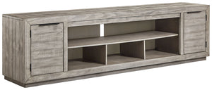 Balancing chic flair with a relaxed sensibility, this extra-large TV stand strikes just the right tone for rustic sophistication. Beautifully clean lines are subtly enhanced with relaxed distressing and saw marks for authentic barn wood character. You-'re