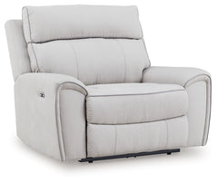 Smart, clean and ultra modern, this power recliner is utterly in vogue. You-'ll love its indulgent cushions and contemporary bustle back styling. The sumptuous fabric, accentuated with contrasting welting, easily blends with your decor. And with reclining