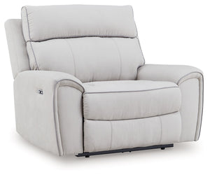 Smart, clean and ultra modern, this power recliner is utterly in vogue. You-'ll love its indulgent cushions and contemporary bustle back styling. The sumptuous fabric, accentuated with contrasting welting, easily blends with your decor. And with reclining