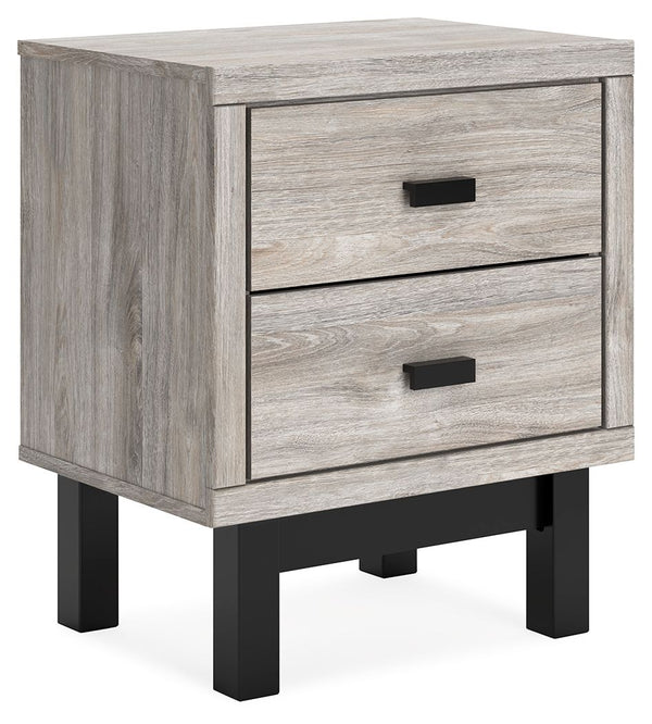 Craft a contemporary hideaway without breaking the bank. An elegant juxtaposition of refined neutral hues, this two-toned nightstand brings sleek style to your space. Matte black drawer handles enhance the sheer simplicity of its profile. With this bedsid