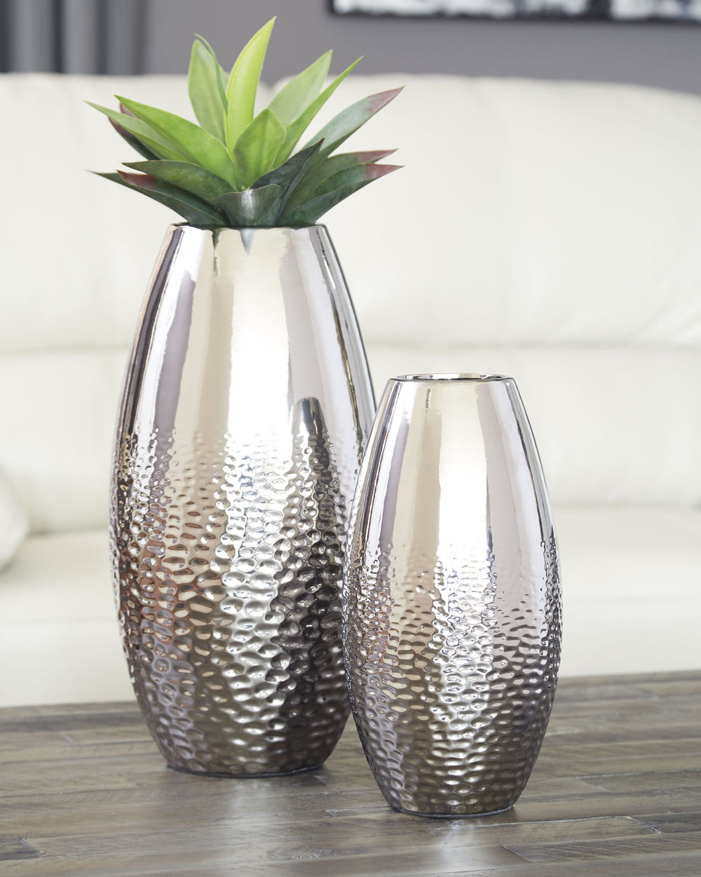 Add subtle glam with this ceramic vase set, reflecting your eclectic eye for design. The textural pattern gracing the sides of the vases evokes ripples of water. A spectacular silvertone glazed finish adds a splash of sheen and shine.<br><br><b>Additional