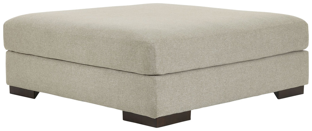 Relax in style on this oversized ottoman. With a look and feel inspired by fine menswear, the spacious piece has rich textures that are easy on the eyes and a pleasure to touch. Its soft, light gray hue and smart tailoring look right at home in any decor.