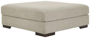 Relax in style on this oversized ottoman. With a look and feel inspired by fine menswear, the spacious piece has rich textures that are easy on the eyes and a pleasure to touch. Its soft, light gray hue and smart tailoring look right at home in any decor.