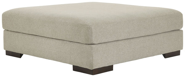 Relax in style on this oversized ottoman. With a look and feel inspired by fine menswear, the spacious piece has rich textures that are easy on the eyes and a pleasure to touch. Its soft, light gray hue and smart tailoring look right at home in any decor.