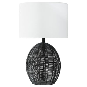 This table lamp combines natural textures with modern craftsmanship, featuring a rounded black rattan base that adds visual intrigue. Paired with a sturdy metal frame for durability and a neutral fabric shade for soft, even lighting, it offers both style 
