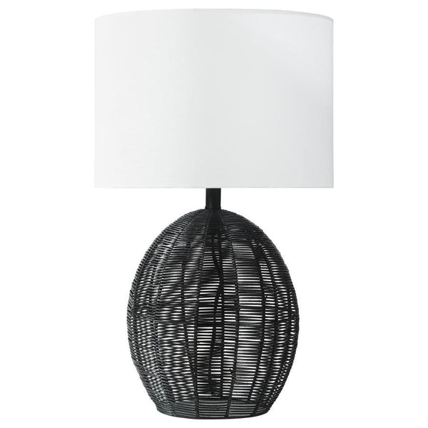 This table lamp combines natural textures with modern craftsmanship, featuring a rounded black rattan base that adds visual intrigue. Paired with a sturdy metal frame for durability and a neutral fabric shade for soft, even lighting, it offers both style 