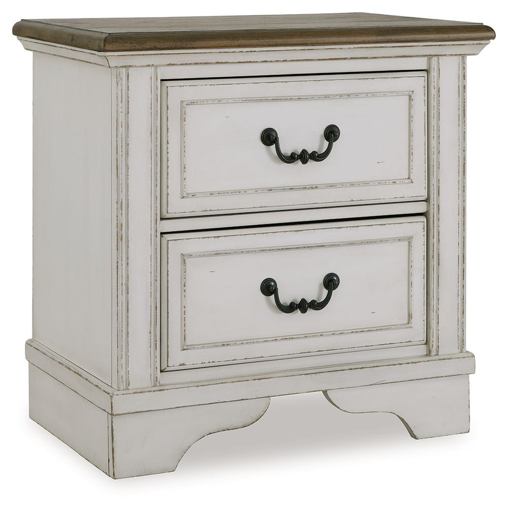 Traditional design. Casual appeal. You can have it all with this nightstand. A relaxed two-tone aesthetic merges with ornate profiled drawer fronts and pilasters to give the distinctive piece an allure all its own. Expansive drawers with quality dovetail 