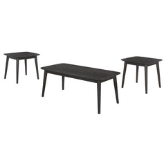 Amid the modern milieu, a three-piece coffee occasional table set stands as a beacon of mid-century inspiration. The coffee table, along with its twin end tables, boasts a black finish so deep it seems to hold secrets within its ash veneer wood grain. Ele