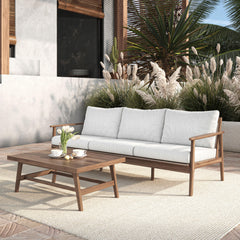 The Ashton 2-Piece Patio Set, featuring a stylish outdoor sofa with natural cushions and a matching coffee table, seamlessly blends durability, comfort, and timeless design to create the ultimate outdoor retreat. Expertly crafted from FSC-Certified Acacia