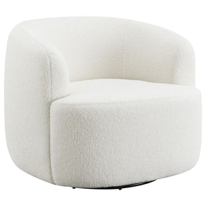 Covered entirely in a plush faux sheepskin material, this swivel chair invites you to curl up and relax. Rotating a full 360 degrees, this accent chair is perfect for open floor plans and versatile spaces. The vintage-inspired barrel-like design offers ul