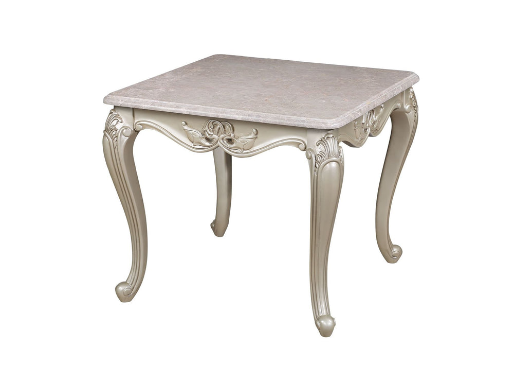 The Monique Royal Classic End Table in champagne showcases heirloom-quality craftsmanship and timeless elegance. Expertly constructed from premium pine solids and adorned with durable polyurethane carvings, this side table is lightweight, moisture-resista