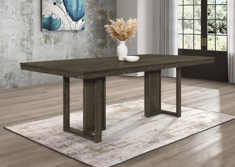 Take your dining experience to new heights with our chic transitional table. The sleek dark grey finish, adorned with a subtle chevron pattern, adds a touch of elegance to any space. The table-'s simple trestle base design brings a modern touch, completin