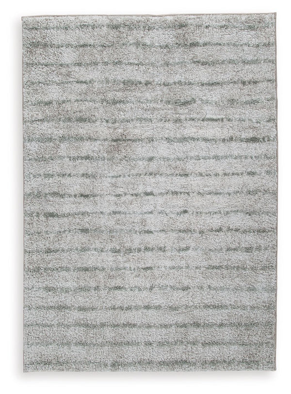 If thereâ€™s any rug that beckons you to slip off your shoes and sink your toes into true comfort, this area rug is it. Just imagine how good the plush woven shag will feel underfoot. And its dreamy, creamy color with sage stripes? The ultimate choice for
