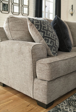  this sectional in a stone-tone neutral upholstery has the corner on style. Merging ultimate comfort with striking good looks