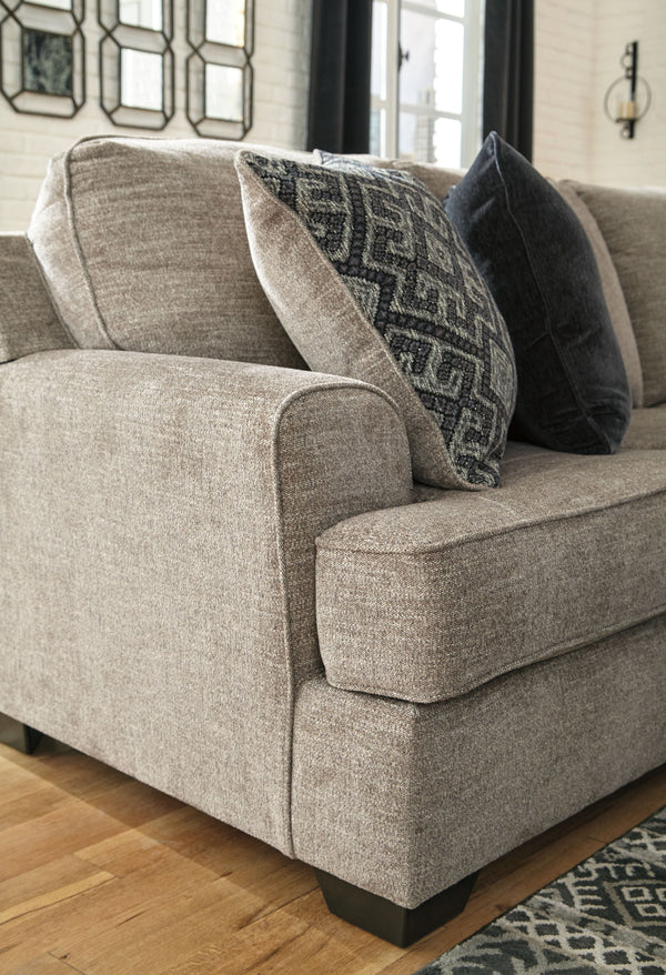  this sectional in a stone-tone neutral upholstery has the corner on style. Merging ultimate comfort with striking good looks