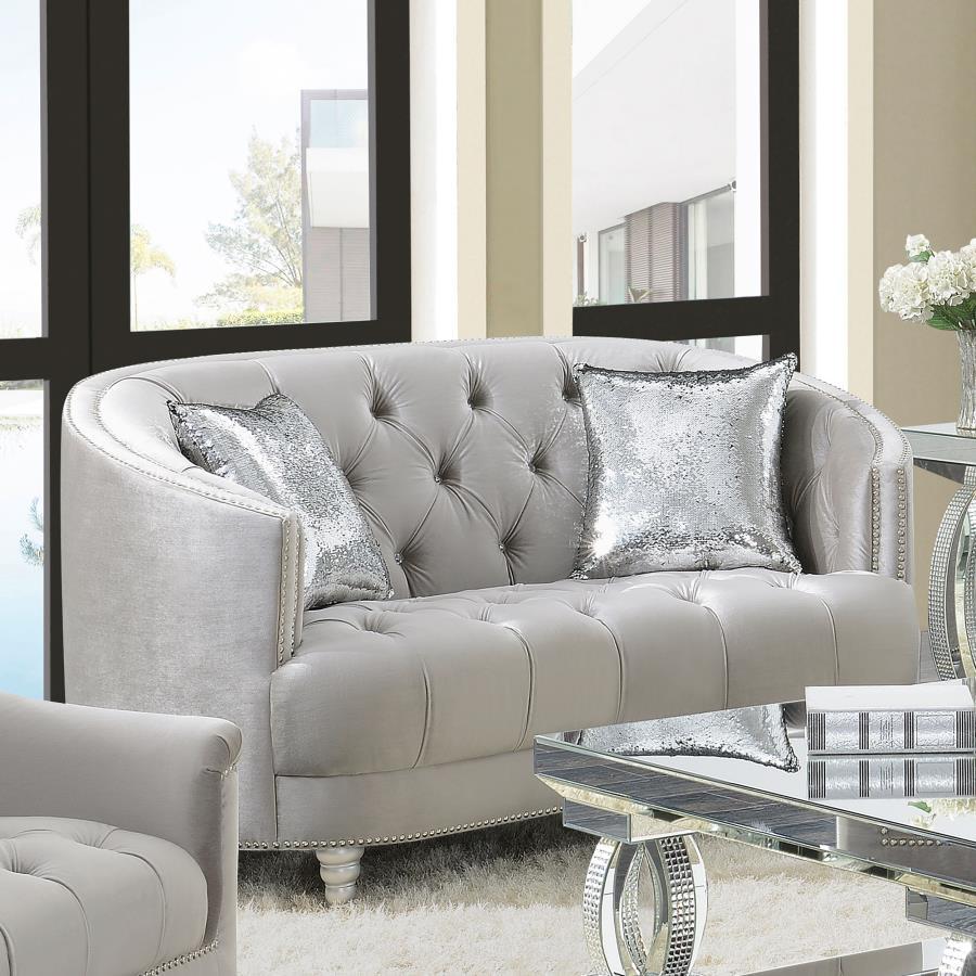 This loveseat envelops you in romantic style and luxury. The button-tufted design is timeless and classic. The wraparound seat back curves down to convenient armrest. Sink into thick cushions for hours peace and quiet while huddled with a book or a partne