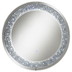 Accentuate your home with this cool, lively decorative wall mirror. The MDF and mirror construction brightens up a front hallway or walk-in closet. The silver hardware finish is highlighted by brilliant crystal accents that deliver glitz and glam. There-'