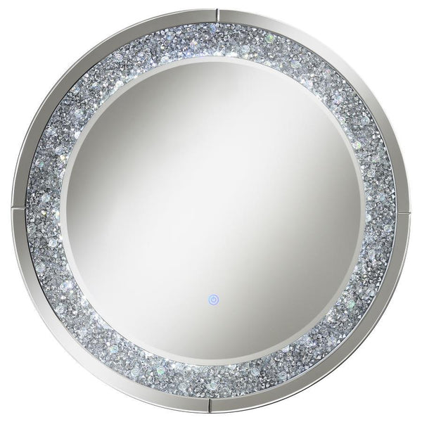 Accentuate your home with this cool, lively decorative wall mirror. The MDF and mirror construction brightens up a front hallway or walk-in closet. The silver hardware finish is highlighted by brilliant crystal accents that deliver glitz and glam. There-'