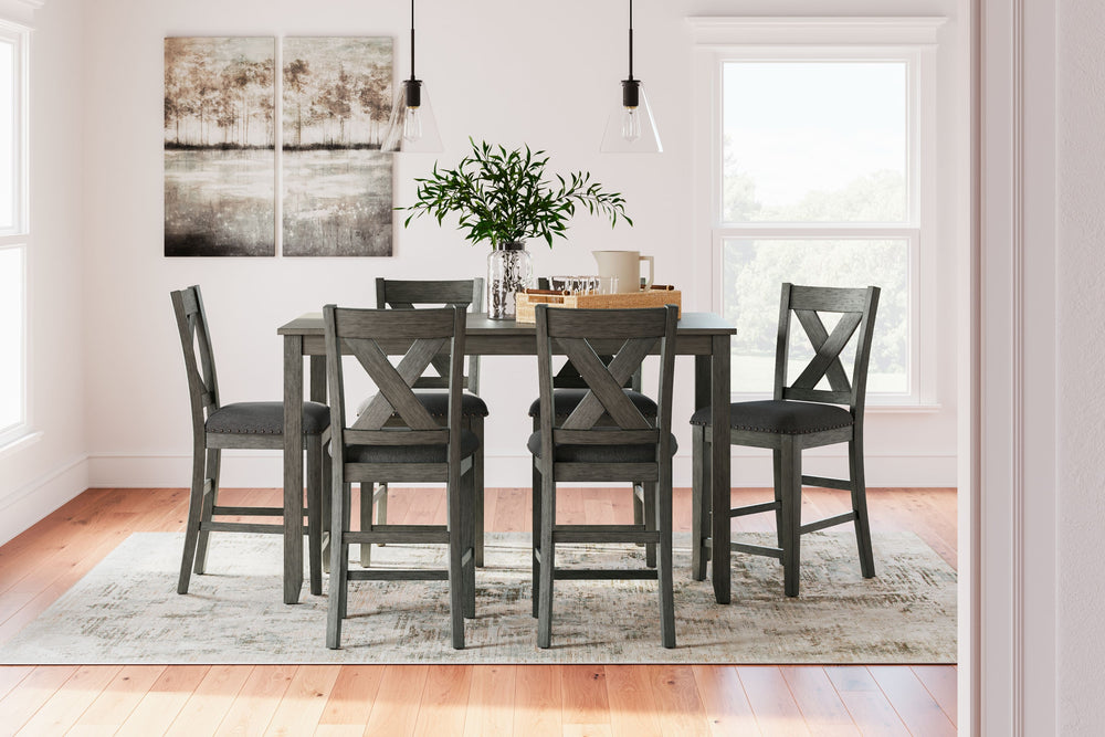 Perfect portion. Striking a simply chic pose, this counter height dining set is crafted with fascinating flair. A subtle gray wash finish gives the clean-lined design a casually cool sensibility. Plushly cushioned seats in a soft, neutral upholstery add t