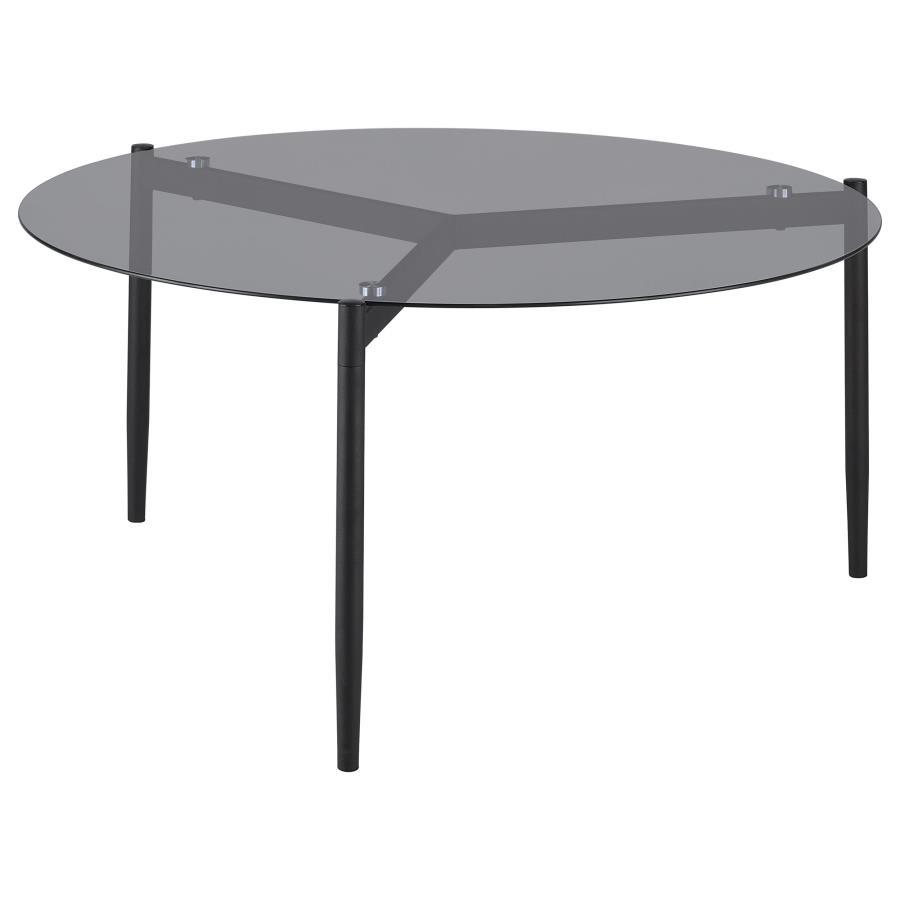 This modern coffee table features a sleek, tempered smoked glass top that adds sophistication to any space. Its sturdy metal base, finished in a black powder-coated sandy texture, provides stability and a contemporary edge. The round design creates a welc