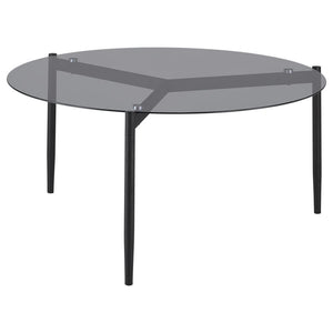 This modern coffee table features a sleek, tempered smoked glass top that adds sophistication to any space. Its sturdy metal base, finished in a black powder-coated sandy texture, provides stability and a contemporary edge. The round design creates a welc