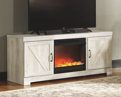 Express your farmhouse style with this TV stand with fireplace insert. Its wispy white finish over replicated oak wood grain is a delightful change from the ordinary. Clean-lined, classic styling with barn door inspiration provides a country chic aestheti