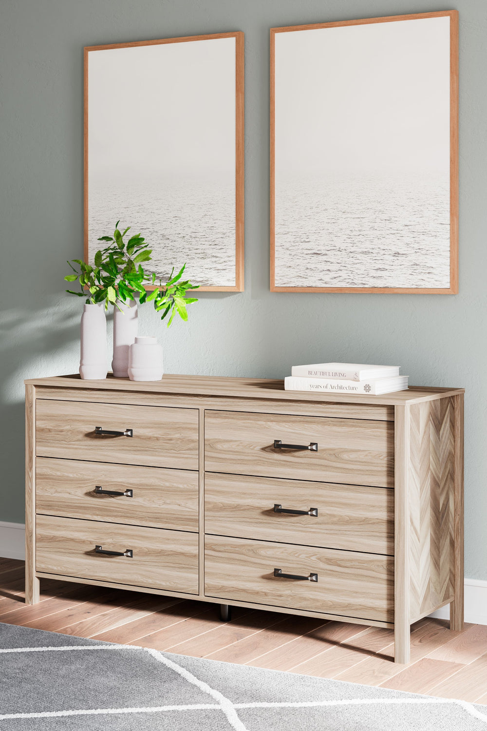 Transform your bedroom into an instant sanctuary. This dresser introduces a touch of mid-century modern style combining a two-tone finish and unique chevron pattern that is sure to enhance the design element to any bedroom. Six spacious drawers with ball 